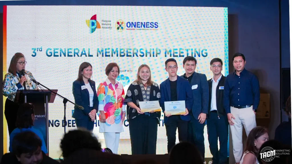 The team from TAGM Marketing Solutions Inc smiling and networking during the PMA Summer Dine and Wine Fellowship event at The Bellevue Hotel in Alabang.
